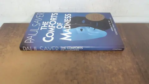 Cover of The Comforts of Madness